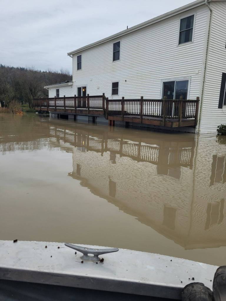 Flood water approaches the Roetcisoender family home at Muddy Boots Pumpkins, December 2025. Photo courtesy of Kerrie Roetcisoender