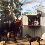 Customers ride their horses through the Sandys Espresso drive thru in the 1990s. This was the second version of the shop. Photo courtesy of Sandy Griffin
