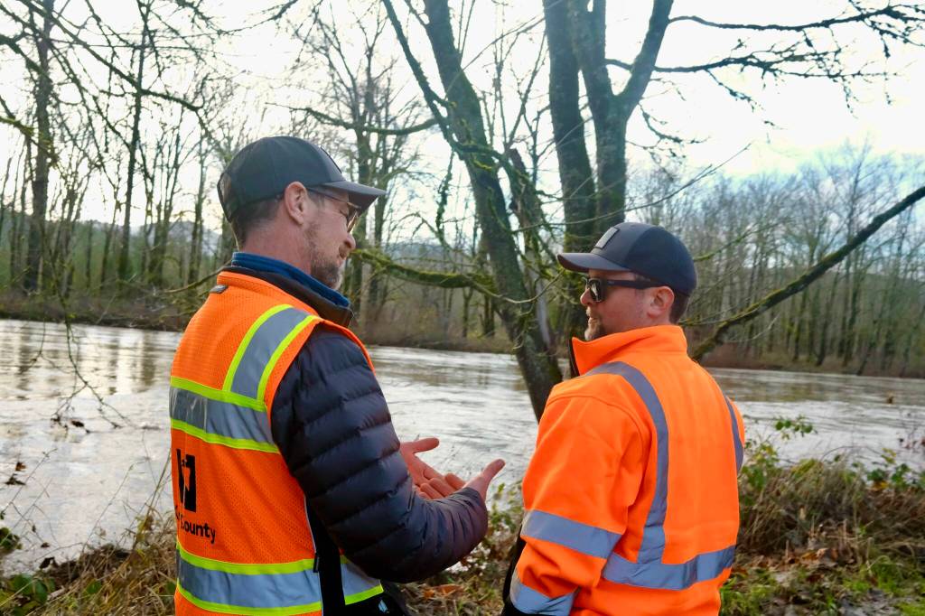 King County Flood Patrol members Thomas Bannister (left) and Seth Ballhorn on their patrol route, Dec. 9, 2025. Grace Gorenflo/Sound Publishing