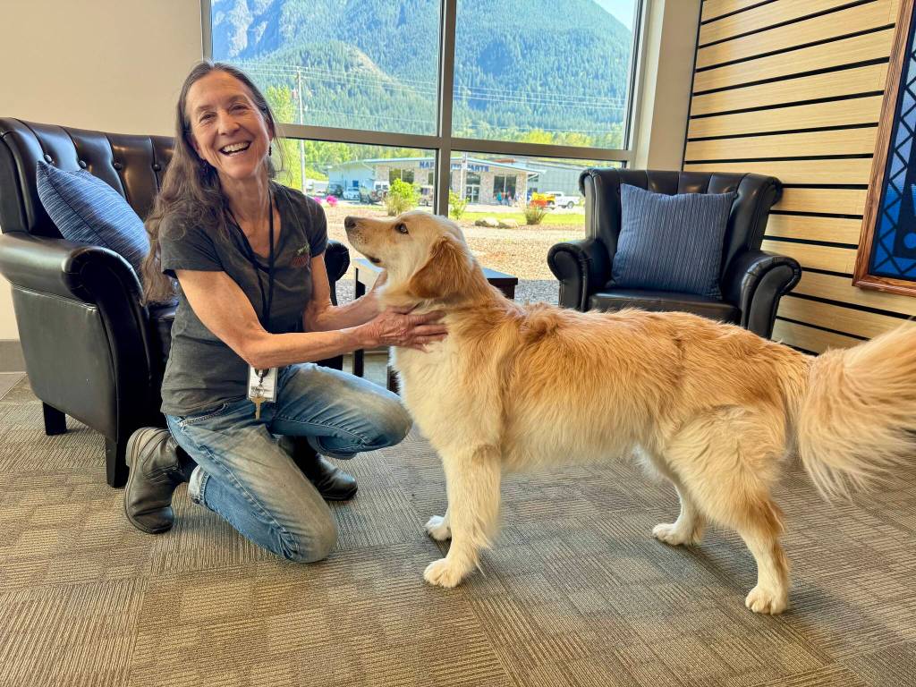 North Bends Administrative Services Director Lisa Escobar with her dog, Harley, at North Bend City Hall, May 2, 2025.