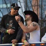 Zach Charbonnet and AJ Barner laugh during the Super Bowl parade. Photos by Ben Ray / Sound Publishing