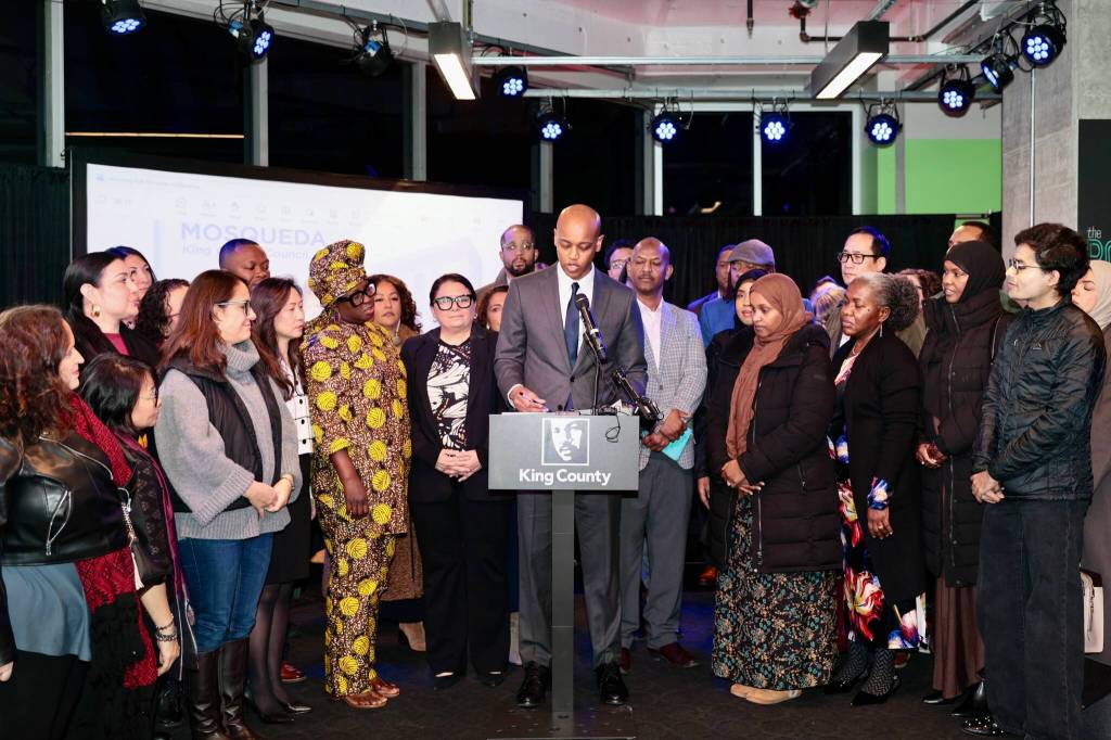 King County Executive Girmay Zahilay, surrounded by community members, announces an executive order to protect immigrants at a press conference Feb. 12, 2026. Photo courtesy of King County Office of the Executive