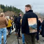 A fan wears a jacket with a painting of the Welcome to Twin Peaks sign on Twin Peaks Day 2026. (Grace Gorenflo/Valley Record)