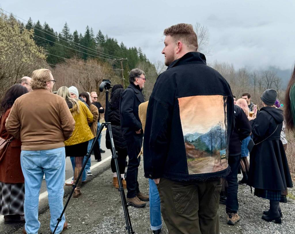 A fan wears a jacket with a painting of the Welcome to Twin Peaks sign on Twin Peaks Day 2026. (Grace Gorenflo/Valley Record)