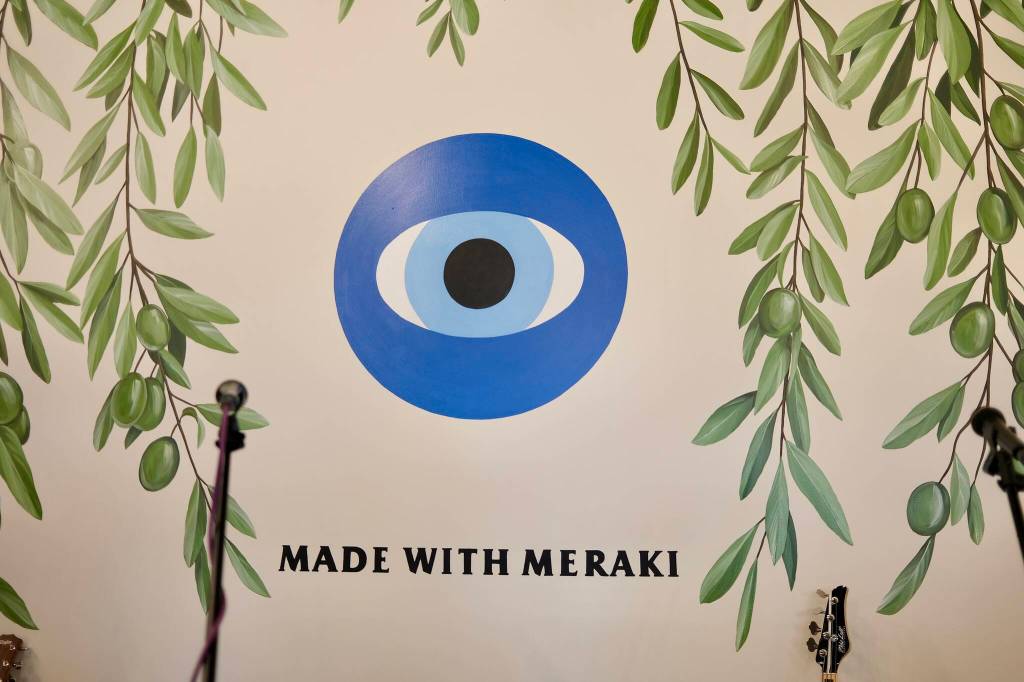 A mural on the wall inside Mastrogiannis Distillery shows the businessess mantra, made with meraki, March 5, 2026.
