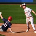 Mount Sis Jacob Flores throws to first base.