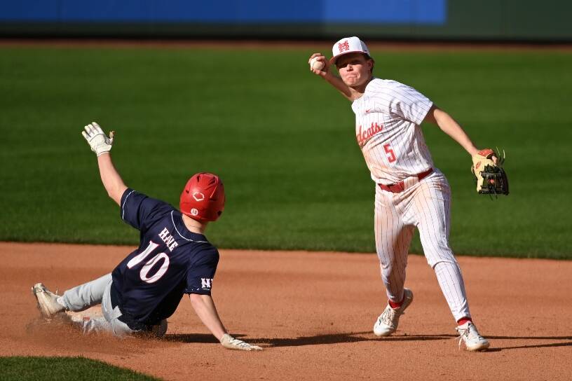 Mount Sis Jacob Flores throws to first base.