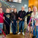 Owner Greg Steed (center) celebrates with friends and family after cutting the ribbon at Blackwater Brewing, April 2, 2026. (Grace Gorenflo/Valley Record)