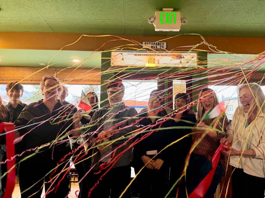 Photos by Grace Gorenflo/Valley Record
The Burrowses celebrate after cutting the ribbon at Paisan Ristorante with their staff and local leaders, April 1, 2026.