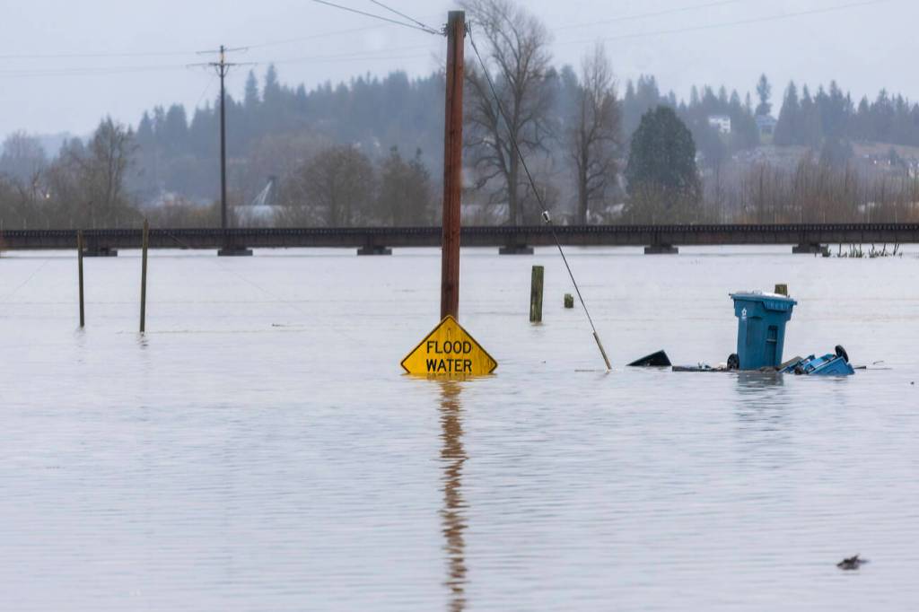 Floodwater from the Snohomish River partially covers a flood water sign along Lincoln Avenue on Thursday, Dec. 11, 2025 in Snohomish, Washington. File photo/Sound Publishing