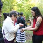 Community members perform a smudging ceremony. Photo by Bailey Jo Josie/Sound Publishing.