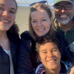 Photo courtesy of Trevor Smith
Trevor Smith (right) with his wife and children at the beach.