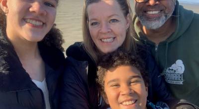 Photo courtesy of Trevor Smith
Trevor Smith (right) with his wife and children at the beach.