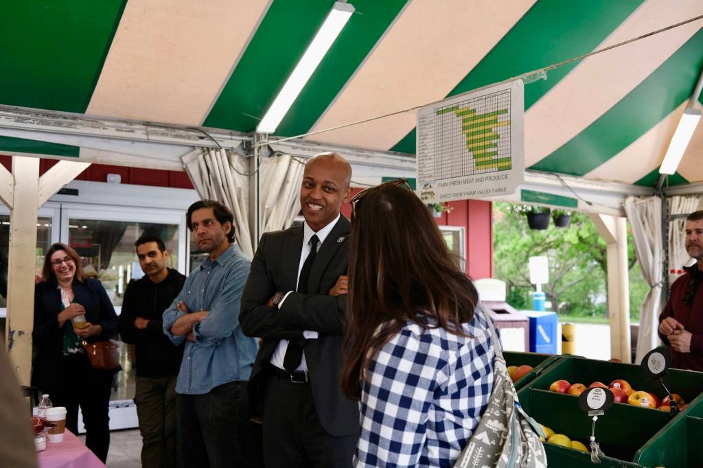King County Executive Girmay Zahilay (middle) chats with local leaders in Fall City, May 5, 2026. (Grace Gorenflo/Valley Record)
