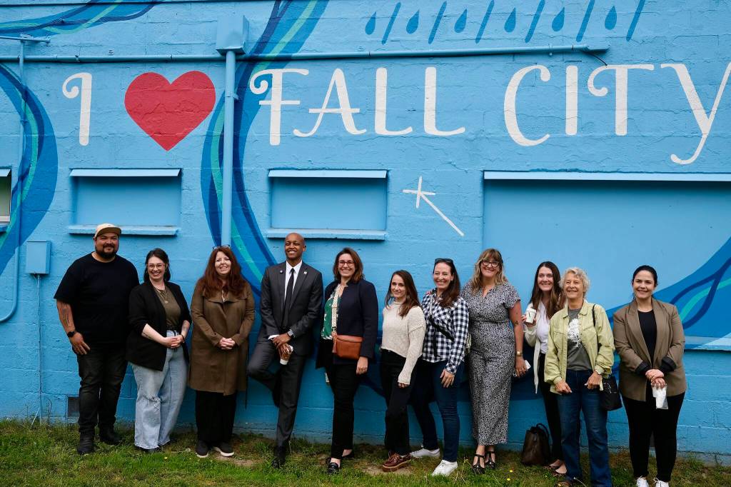 King County Executive Girmay Zahilay (fourth from left) stands for a photo with local leaders and business owners in Fall City, May 5, 2026. (Grace Gorenflo/Valley Record)