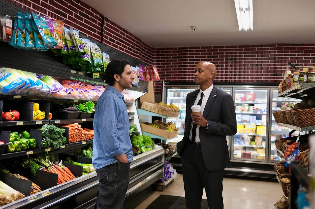 King County Executive Girmay Zahilay (right) talks with Saeed Anwar, owner of Farmhouse Market, May 5, 2026. (Grace Gorenflo/Valley Record)