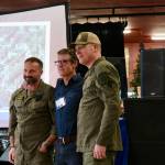 Grace Gorenflo / Valley Record
Two Search and Rescue members stand with a man they rescued last year after telling their story at SARposium, May 14, 2026.