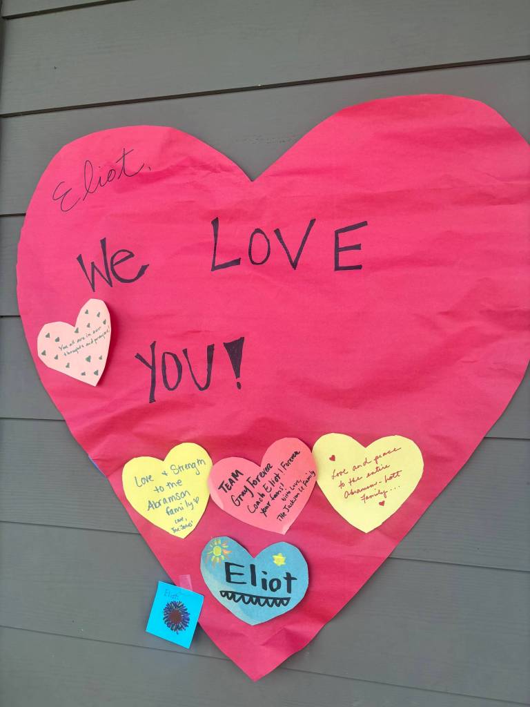 In the following photos, community members placed notes and flowers at a memorial for Eliot Abramson at the Mercer Island High School stadium. Staff photos by Andy Nystrom