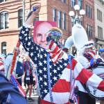 An American Outlaw marches to Seattle Stadium. Ben Ray / The Reporter