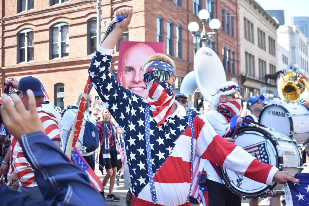 An American Outlaw marches to Seattle Stadium. Ben Ray / The Reporter