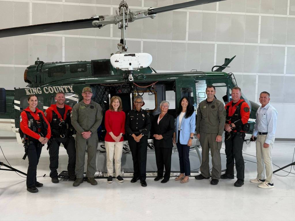 U.S. Congresswoman Kim Schrier and King County Sheriff Patti Cole-Tindall celebrate with King County Councilmembers and the rescue team in front of one of the countys two rescue helicopters equipped with hoist technology. Photo provided by the office of Kim Schrier