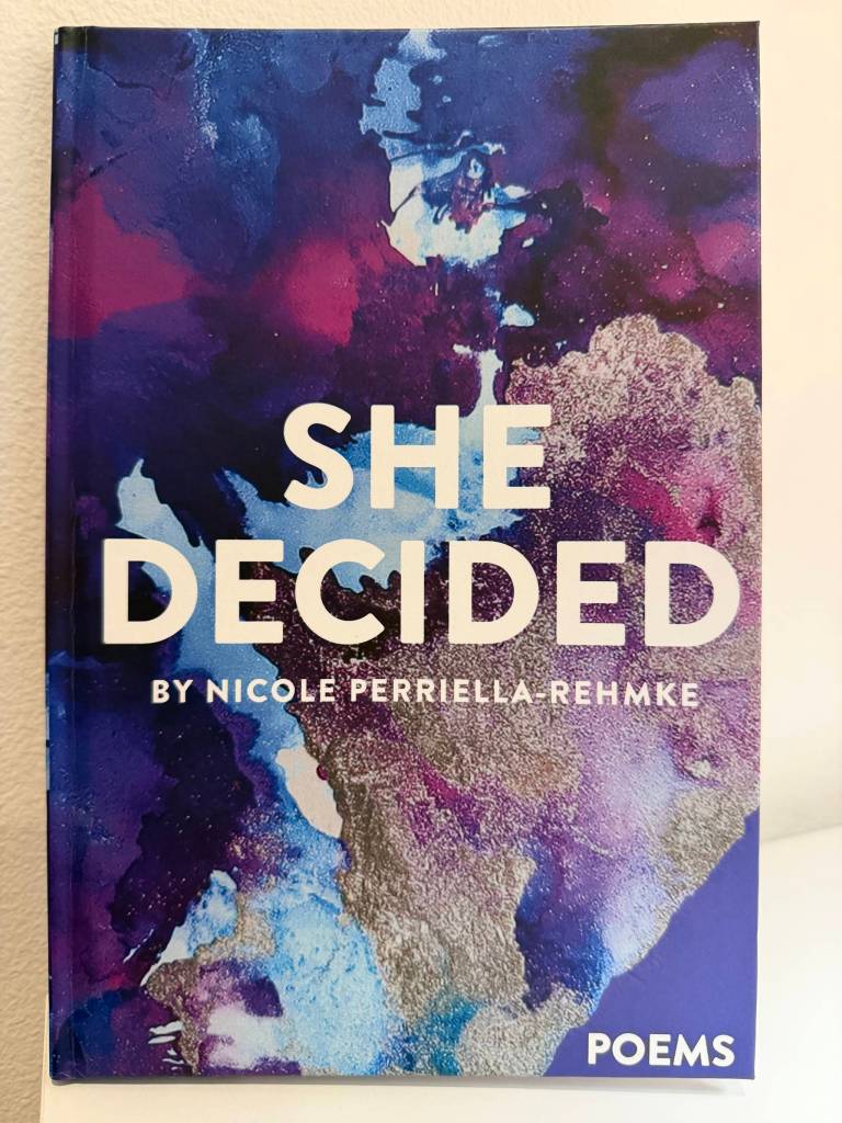 The cover of She Decided by Nicole Perriella-Rehmke uses watercolor art made by Perriella-Rehmkes daughter. (Grace Gorenflo/Valley Record)