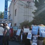 Grace Gorenflo/Valley Record
Protestors stand outside North Bend Theatre during a primary candidate forum July 14, 2026.
