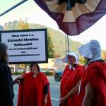 Grace Gorenflo/Valley Record
Women dressed in attire from The Handmaids Tale protest outside North Bend Theatre during a primary candidate forum July 14, 2026.